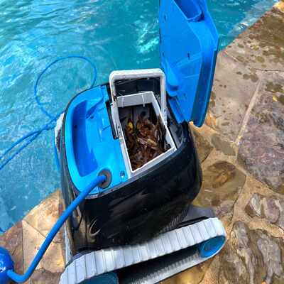 Robotic pool cleaner that scrubs the pool floor, walls, and waterline automatically